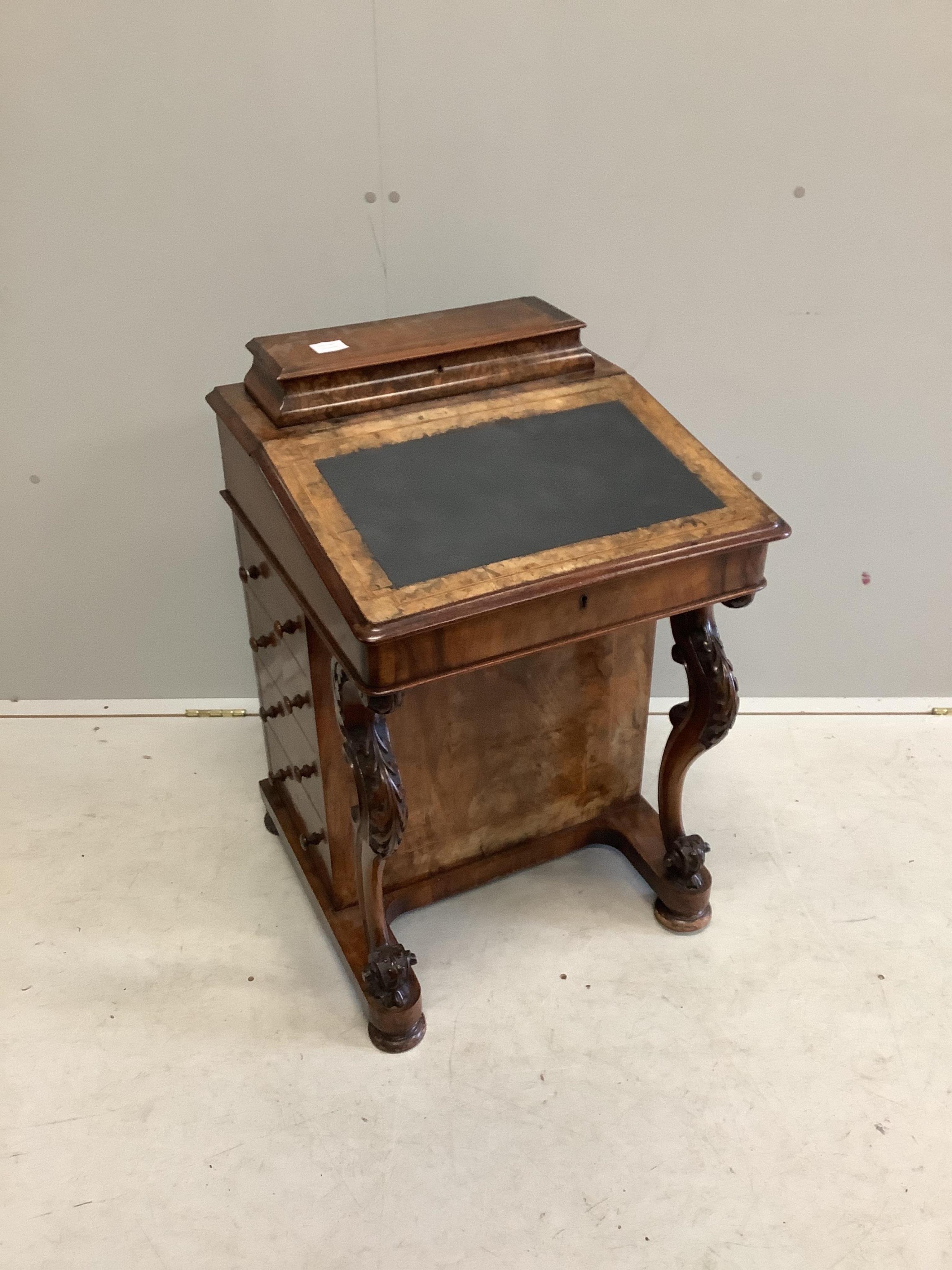 A late Victorian banded figured walnut Davenport, width 54cm, depth 54cm, height 78cm. Condition - fair